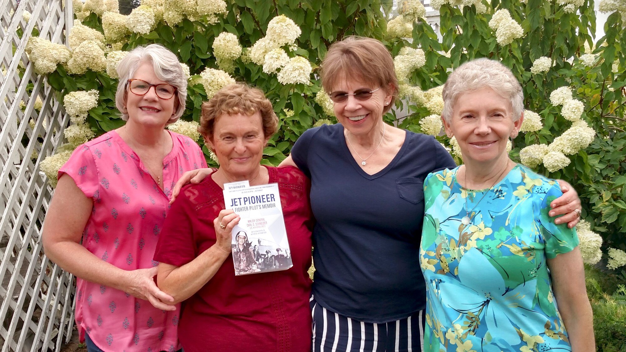 The AEDC Woman’s Club board members display the Jet Pioneer book written by Maj. Gen. Carl Schneider. Schneider will be speaking about his Air Force career at the next AEDCWC meeting Sept. 6. Pictured left to right are Susan Harris, Barbara McGuire, Gale Klingelhoets and Kelly Doyle.