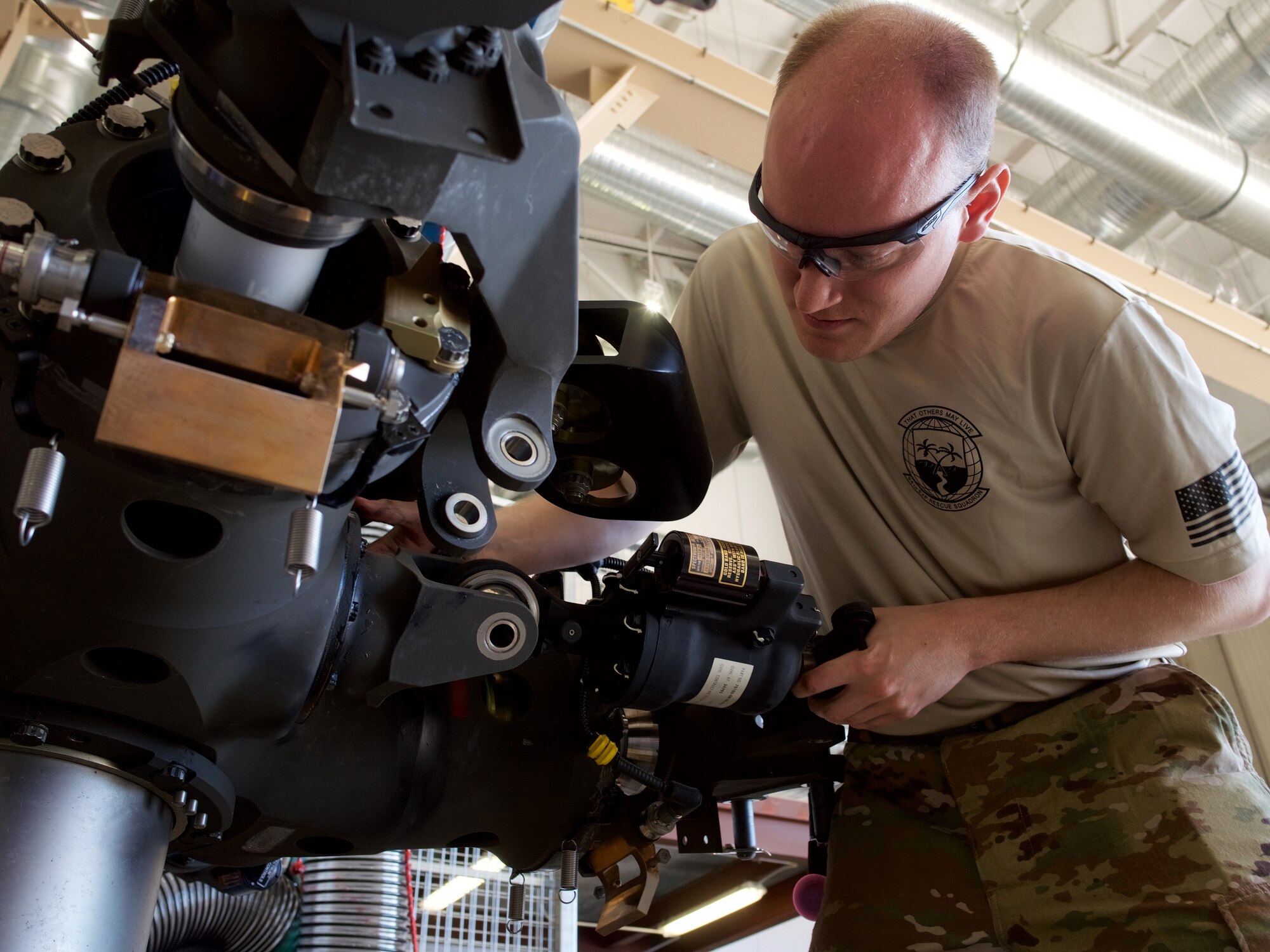 Air Guardsmen conduct phase inspection on HH-60G Pave Hawk.