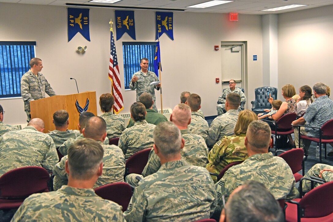 Lt. Col. Chad Manifold, commander of the 911th Communications Squadron, gives a speech during an assumption of command ceremony at the Pittsburgh International Airport Air Reserve Station, Pennsylvania, Aug. 4, 2018. During this ceremony, Manifold assumed command with the support of family, friends, fellow commanders, and new subordinates. (U.S. Air Force photo by Staff Sgt. Marjorie A. Bowlden)