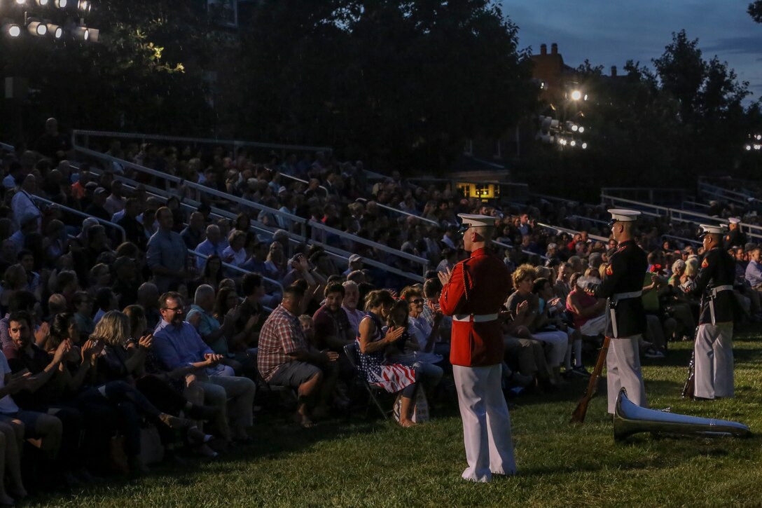 Crowd educators with Marine Barracks Washington D.C. speak with guests of a Friday Evening Parade at the Barracks, Aug. 17, 2018. The guest of honor for the parade was the Honorable James F. Geurts, assistant secretary of the Navy for Research, Development and Acquisition and the hosting official was Lt. Gen. Michael G. Dana, director, Marine Corps Staff. (Official Marine Corps photo by Sgt. Robert Knapp/Released)