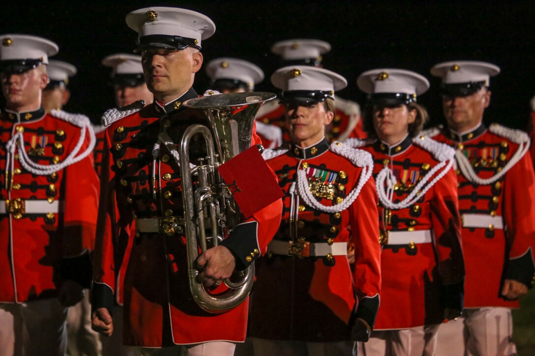Marines with “The President’s Own” U.S. Marine Band march across the parade deck during a Friday Evening Parade at Marine Barracks Washington D.C., Aug. 17, 2018. The guest of honor for the parade was the Honorable James F. Geurts, assistant secretary of the Navy for Research, Development and Acquisition and the hosting official was Lt. Gen. Michael G. Dana, director, Marine Corps Staff. (Official Marine Corps photo by Sgt. Robert Knapp/Released)