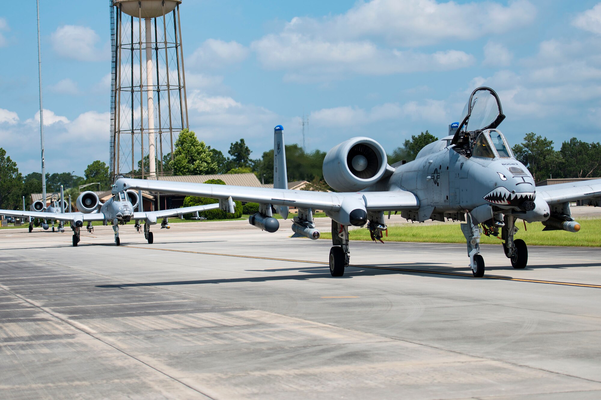 A-10C Thunderbolt IIs taxi on the runway toward a hot-pit refueling point, Aug. 14, 2018, at Moody Air Force Base, Ga. Members of the 23d Logistics Readiness Squadron preposition fueling trucks to allow aircraft to refuel without needing to shut down. This style of refueling is used to eliminate the need for additional maintenance procedures and to extend pilots’ training time per flight which improves operations tempo. (U.S. Air Force photo by Airman 1st Class Erick Requadt)