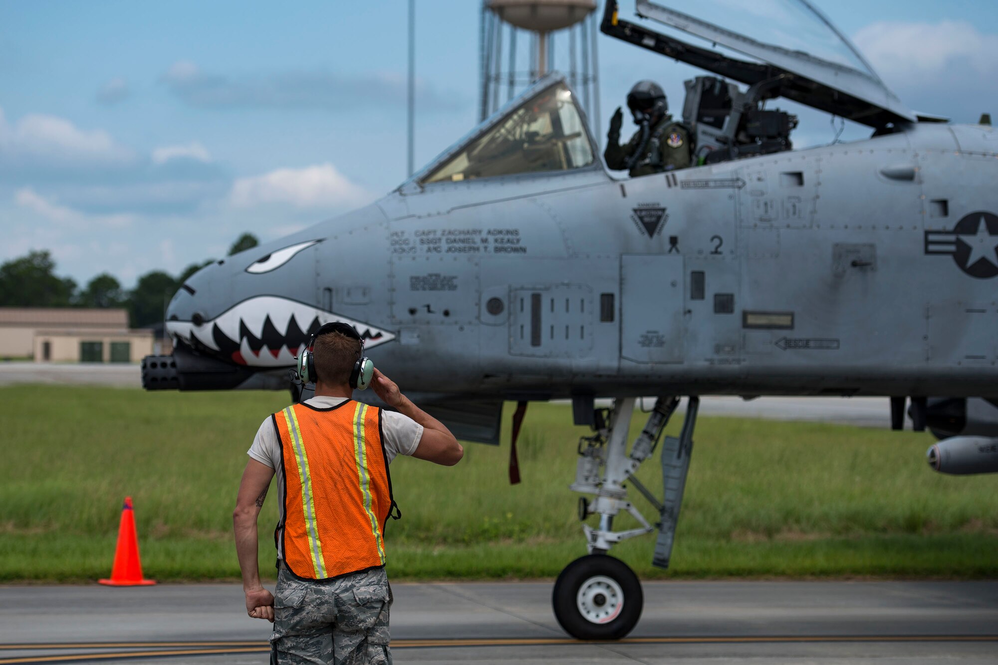 Tech. Sgt. Brandon Hoke, 476th Maintenance Squadron crew chief, renders a salute to a pilot after hot pit refueling an A-10C Thunderbolt II, Aug. 14, 2018, at Moody Air Force Base, Ga. Members of the 23d Logistics Readiness Squadron preposition fueling trucks to allow aircraft to refuel without needing to shut down. This style of refueling is used to eliminate the need for additional maintenance procedures and to extend pilots’ training time per flight which improves operations tempo. (U.S. Air Force photo by Airman 1st Class Erick Requadt)