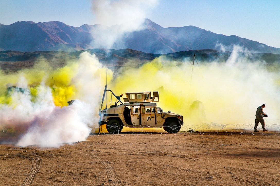 Soldiers put on gas masks during training.