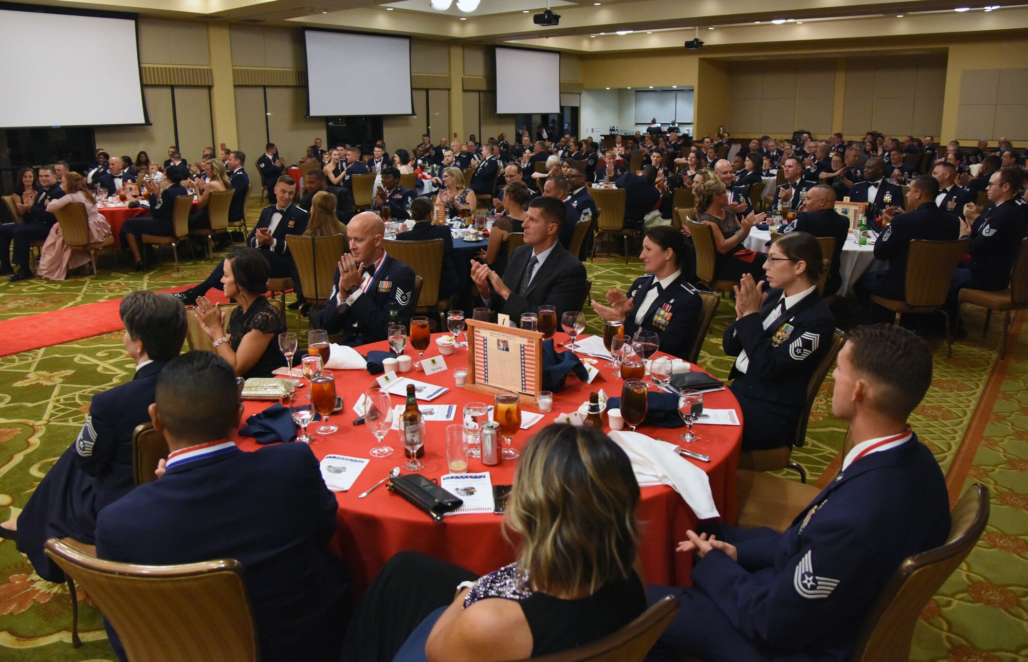 Keesler personnel attend the Senior NCO Induction Ceremony at the Bay Breeze Event Center at Keesler Air Force Base, Mississippi, Aug. 17, 2018. More than 50 inductees were recognized during the event. A medallion ceremony and a candle lighting ceremony also took place during the event. (U.S. Air Force photo by Kemberly Groue)