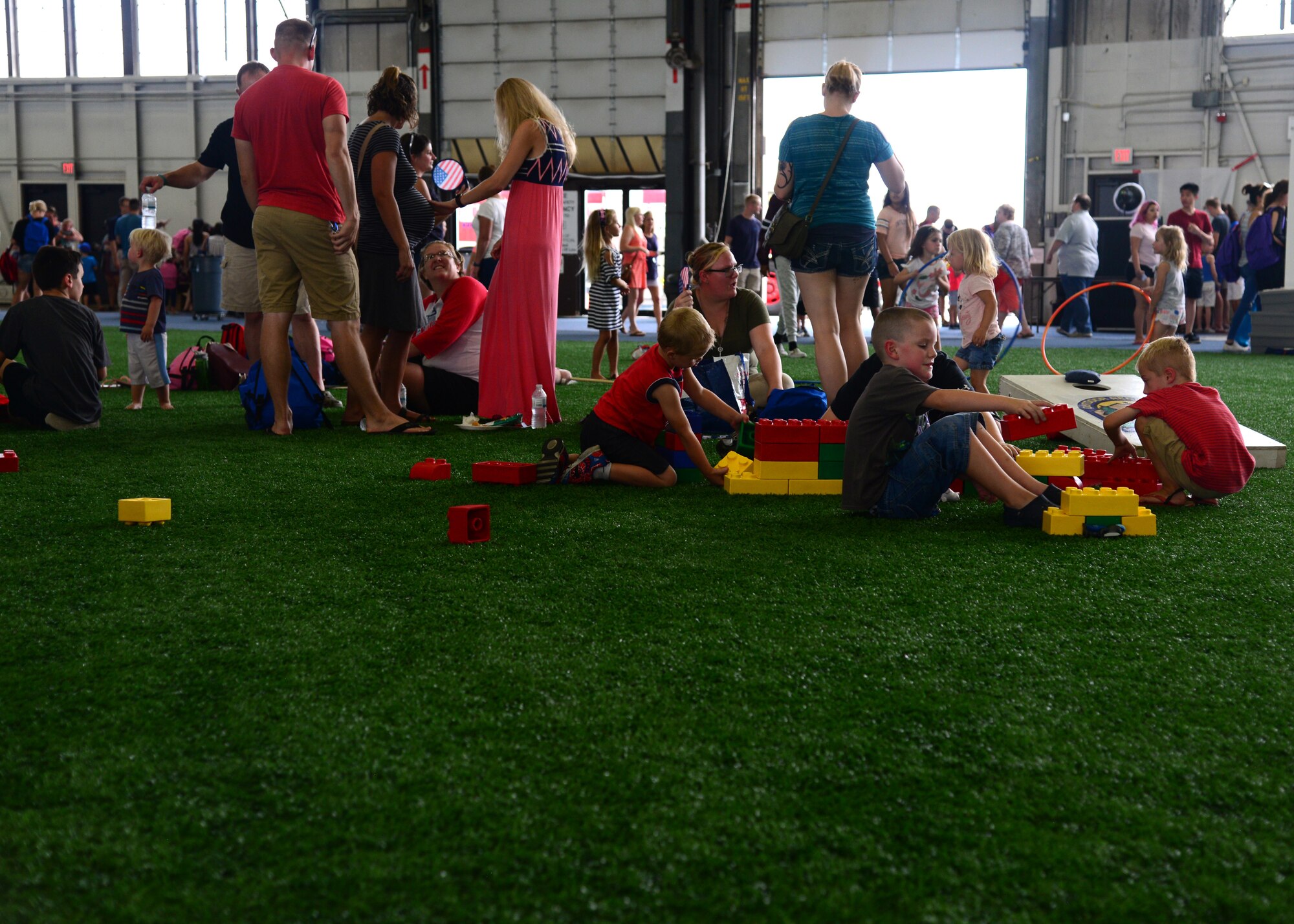 Children and families from Ellsworth Air Force Base, South Dakota, play with a set of building blocks during the Back-to-School Roundup, August 18, 2018. This event was a fun way to kick off the school year with games and free school supplies for military families. (U.S. Air Force photo by Senior Airman Denise M. Jenson)