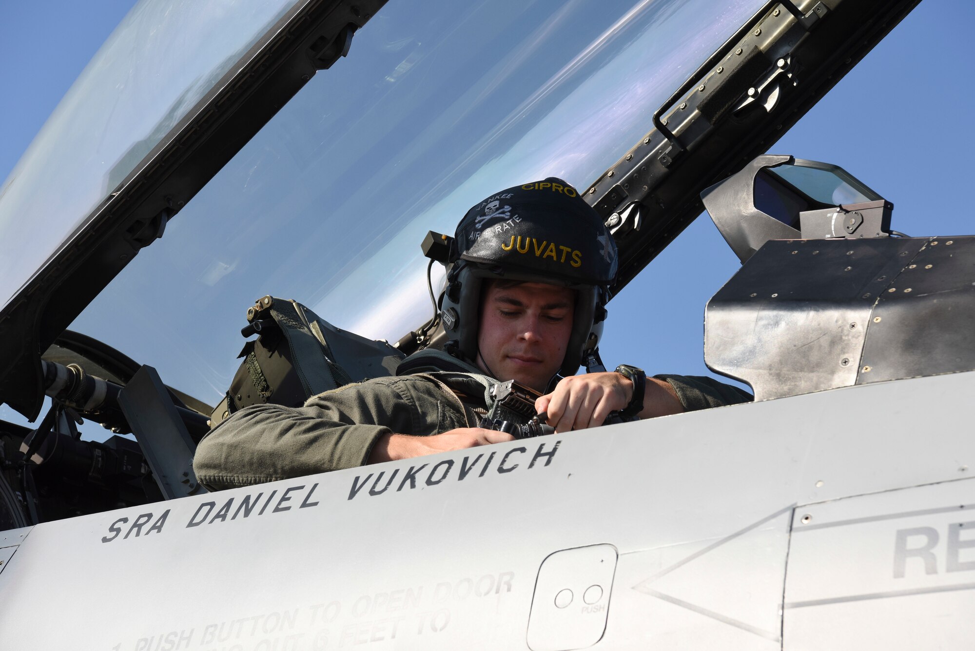 U.S. Air Force Capt. William Fleming, 80th Fighter Squadron pilot, buckles himself into an F-16 Fighting Falcon before flight during Exercise Pitch Black 2018, at Royal Australian Air Force Base Darwin, Australia, Aug. 2, 2018. PBK18 allows regional partners and participating nations to exercise deployed units in the tasking, planning, and execution of offensive counter-air and offensive air support, such as basic fighting maneuvers, air combat maneuvers, and close air support. (U.S. Air Force photo by Senior Airman Savannah L. Waters)