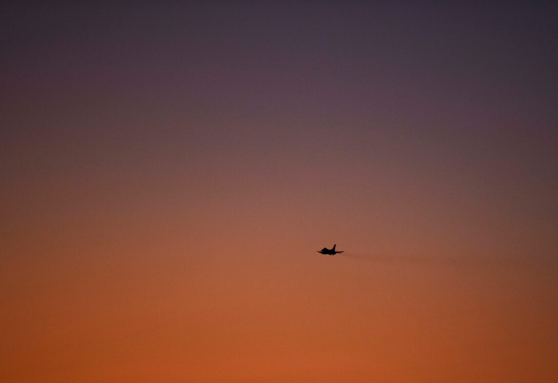 A U.S. Air Force F-16 Fighting Falcon from Kunsan Air Base, Republic of Korea, flies at sunset during Exercise Pitch Black 2018 at Royal Australian Air Force Base Darwin, Australia, Aug. 9, 2018. This training focuses on exercising international forces in the planning and execution of large-scale offensive, counter-air and counter-land operations in a coalition environment against a capable adversary force. (U.S. Air Force photo by Senior Airmen Savannah L. Waters)