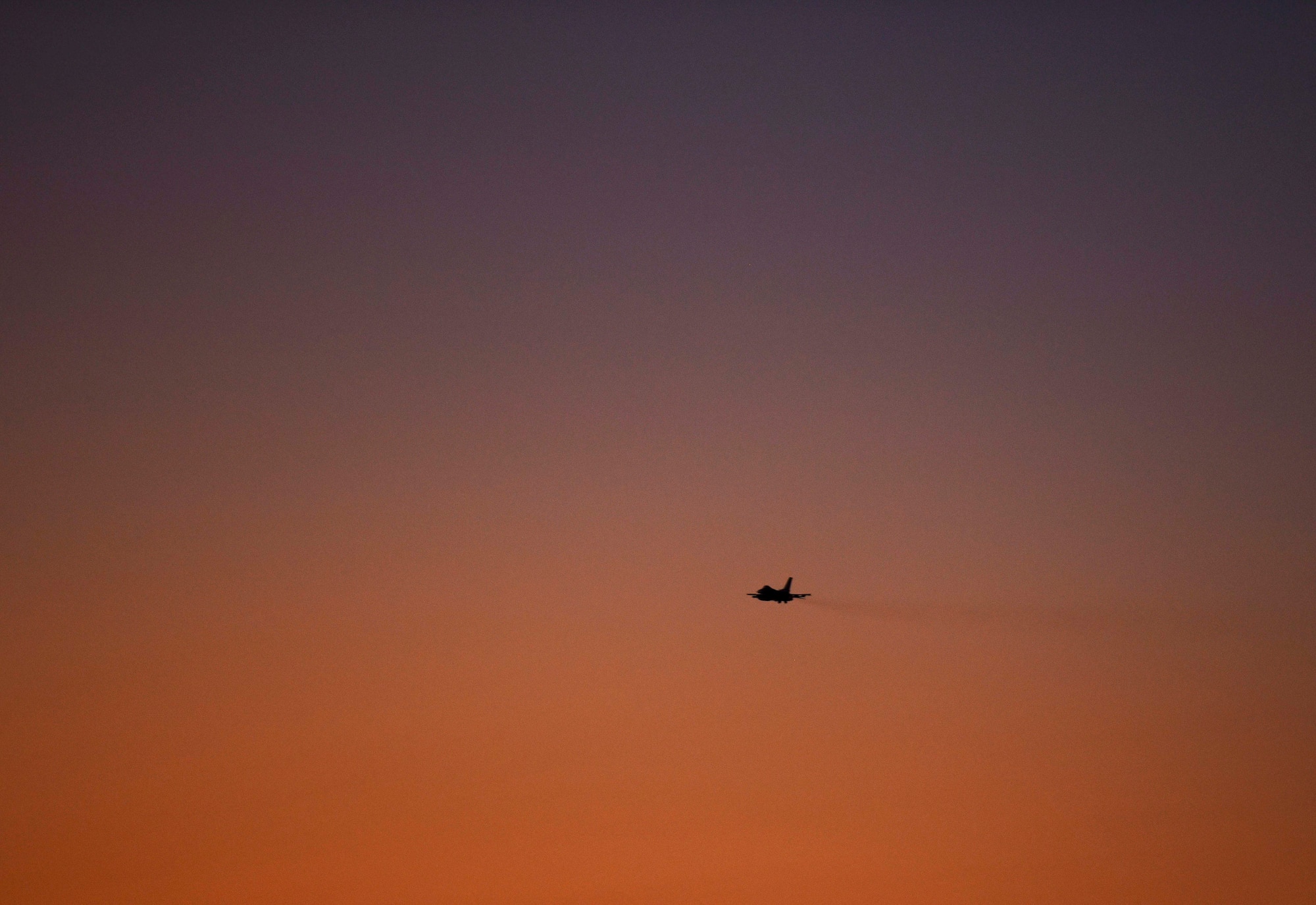 A U.S. Air Force F-16 Fighting Falcon from Kunsan Air Base, Republic of Korea, flies at sunset during Exercise Pitch Black 2018 at Royal Australian Air Force Base Darwin, Australia, Aug. 9, 2018. This training focuses on exercising international forces in the planning and execution of large-scale offensive, counter-air and counter-land operations in a coalition environment against a capable adversary force. (U.S. Air Force photo by Senior Airmen Savannah L. Waters)