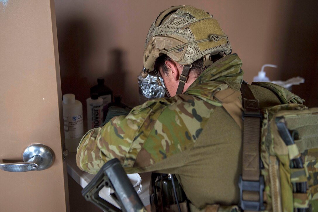 An Australian soldier finds a possible homemade explosive device.