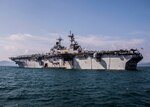 Amphibious assault ship USS Essex (LHD 2) anchors off the coast of Kota Kinabalu, Malaysia in support of Cooperation Afloat Readiness and Training (CARAT) 2018. CARAT Malaysia in its 24th iteration, is designed to enhance information sharing and coordination, build mutual warfighting capability and support long-term regional cooperation enabling both partner armed forces to operate effectively together as a unified maritime force.