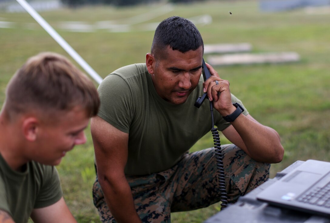 Marines with Marine Aircraft Group 13 communicate with Marines at Marine Corps Air Station Miramar utilizing high frequency communication equipment during Exercise Northern Lightning at Volk Field Counterland Training Center, Camp Douglas, Wis. Aug. 16. Exercise Northern Lightning 2018 allows the Air Force, Marine Corps and Navy to strengthen interoperability between services and gives the different branches a greater understanding of aviation capabilities within a joint fighting force.