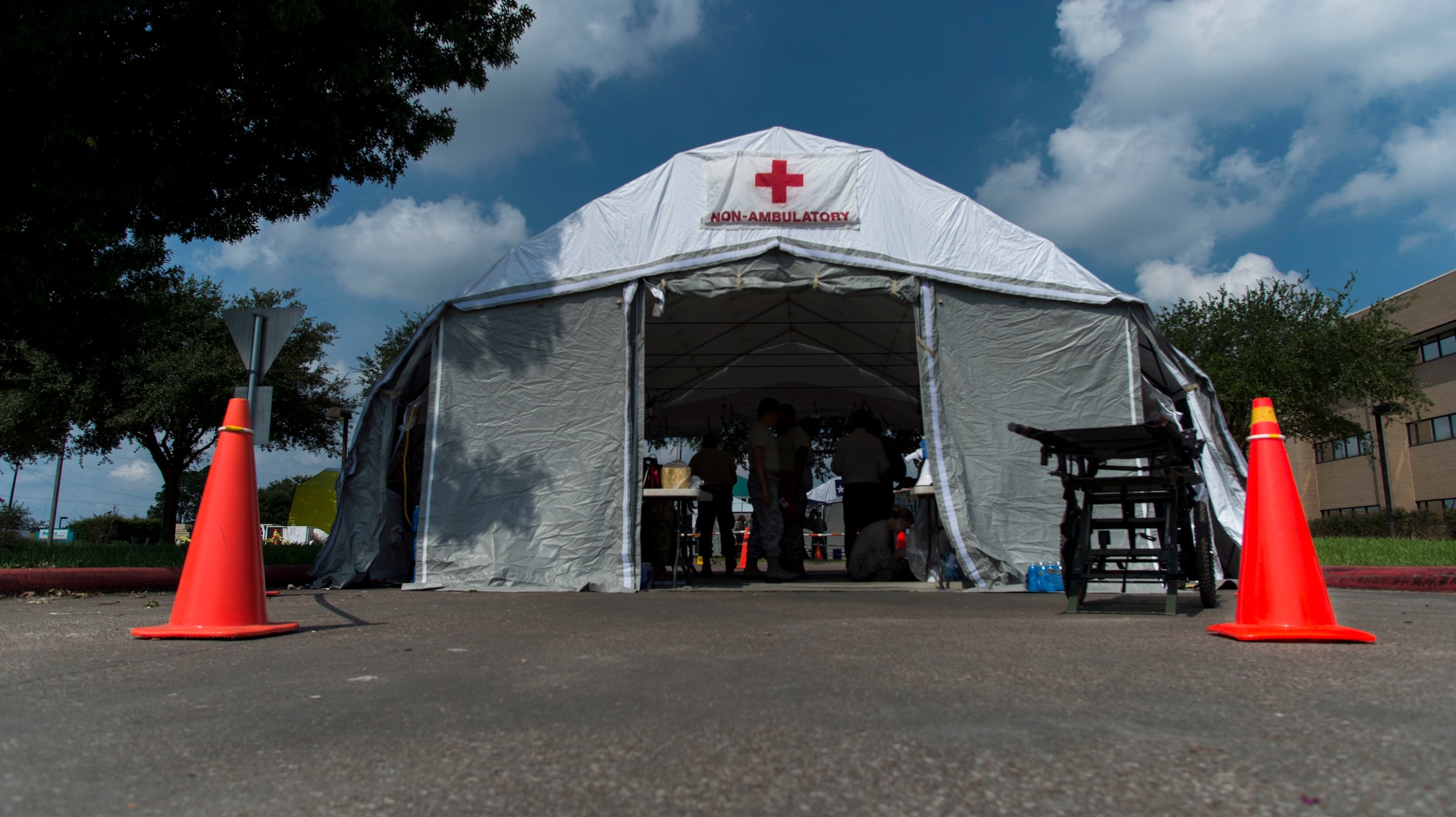 A Chemical Emergency Response Force Package comprised of Texas Air National Guard Airmen with the 149th Medical Wing, Joint Base San Antonio-Lackland, Texas, and Texas National Guard Soldiers, Fort Worth, Texas, with the 949th Brigade Support Battalion combined to set up this field hospital in the parking lot of the Baptist Hospitals of Southeast Texas Beaumont as the hospital was only taking medical emergencies due to damage caused by Hurricane Harvey. (U.S. Air Force photo by Airman 1st Class Nicholas Dutton)