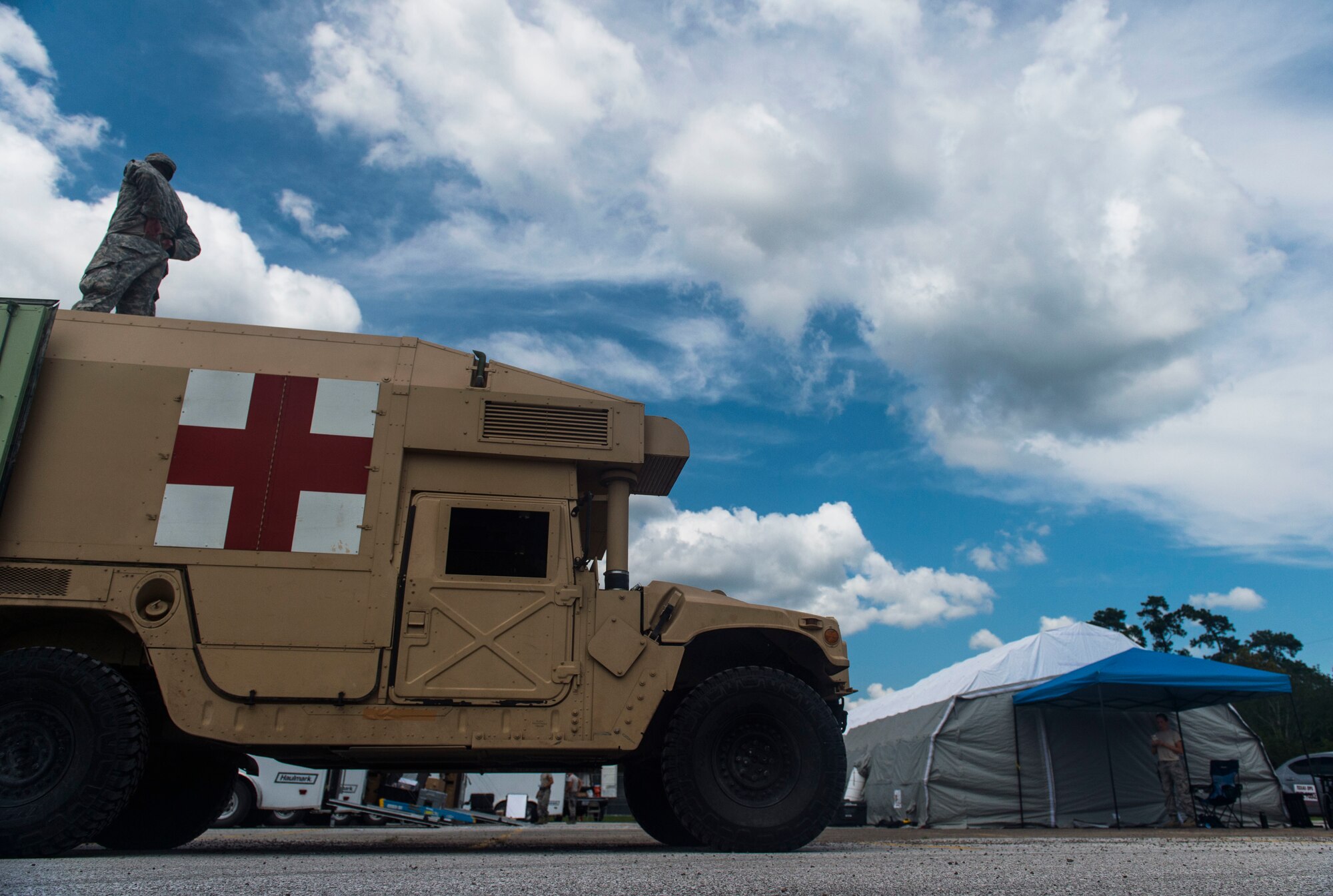 Nebraska Air National Guard Airman from the 155th Medical Group, Lincoln Air National Guard Base, Nebraska, set up a field hospital in Vidor, Texas, to assistant local residents with medical care after Hurricane Harvey, Sept. 5, 2017. The field hospital, set up in the parking lot of Vidor High school, allowed residents easy access to medical care in areas heavily affected by Hurricane Harvey. (U.S. Air Force photo by Airman 1st Class Nicholas Dutton)