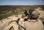 Sniper team fires at long-range targets.