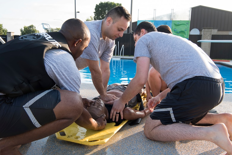 A team of medics assigned to the 436th Medical Group perform life saving measures on a training dummy Aug. 1, 2018, at Dover Air Force Base, Del., in preparation for the annual Emergency Medical Technician Rodeo in Cannon AFB and Melrose Air Force Range, N.M. A total of 21 Air Force EMT teams from around the world competed in the rodeo, held August 7-10. (U.S. Air Force photo by Staff Sgt. Aaron J. Jenne)