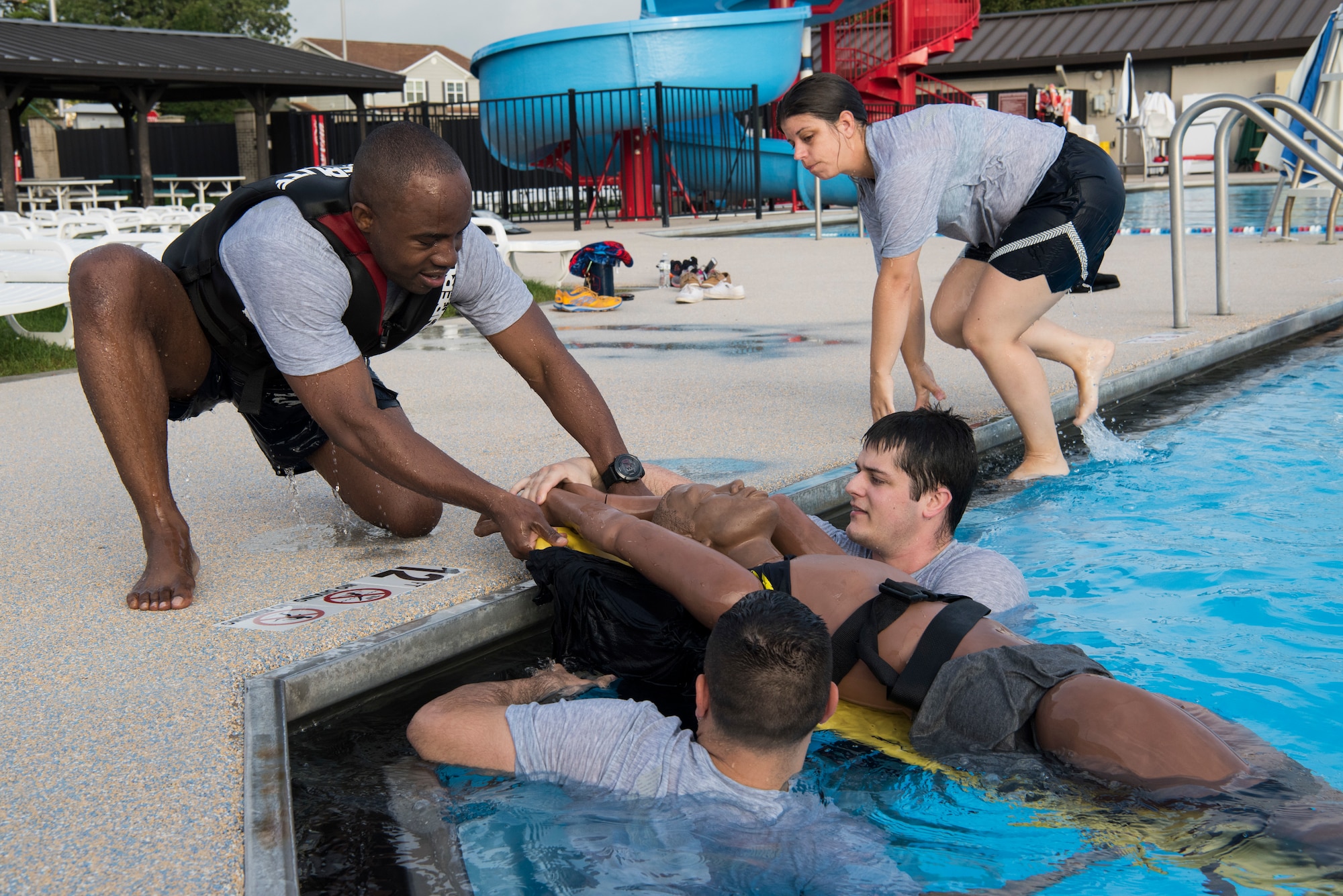 Senior Airman Joseph Serat, 436th Medical Operations Squadron medical technician, pulls a training dummy out of the pool during a training session Aug. 8, 2018, at Dover Air Force Base, Del. A team of four from Dover AFB competed in the 11th annual Emergency Medical Technician Rodeo held August 7-10 at Cannon AFB and Melrose Air Force Range, N.M. (U.S. Air Force photo by Staff Sgt. Aaron J. Jenne)