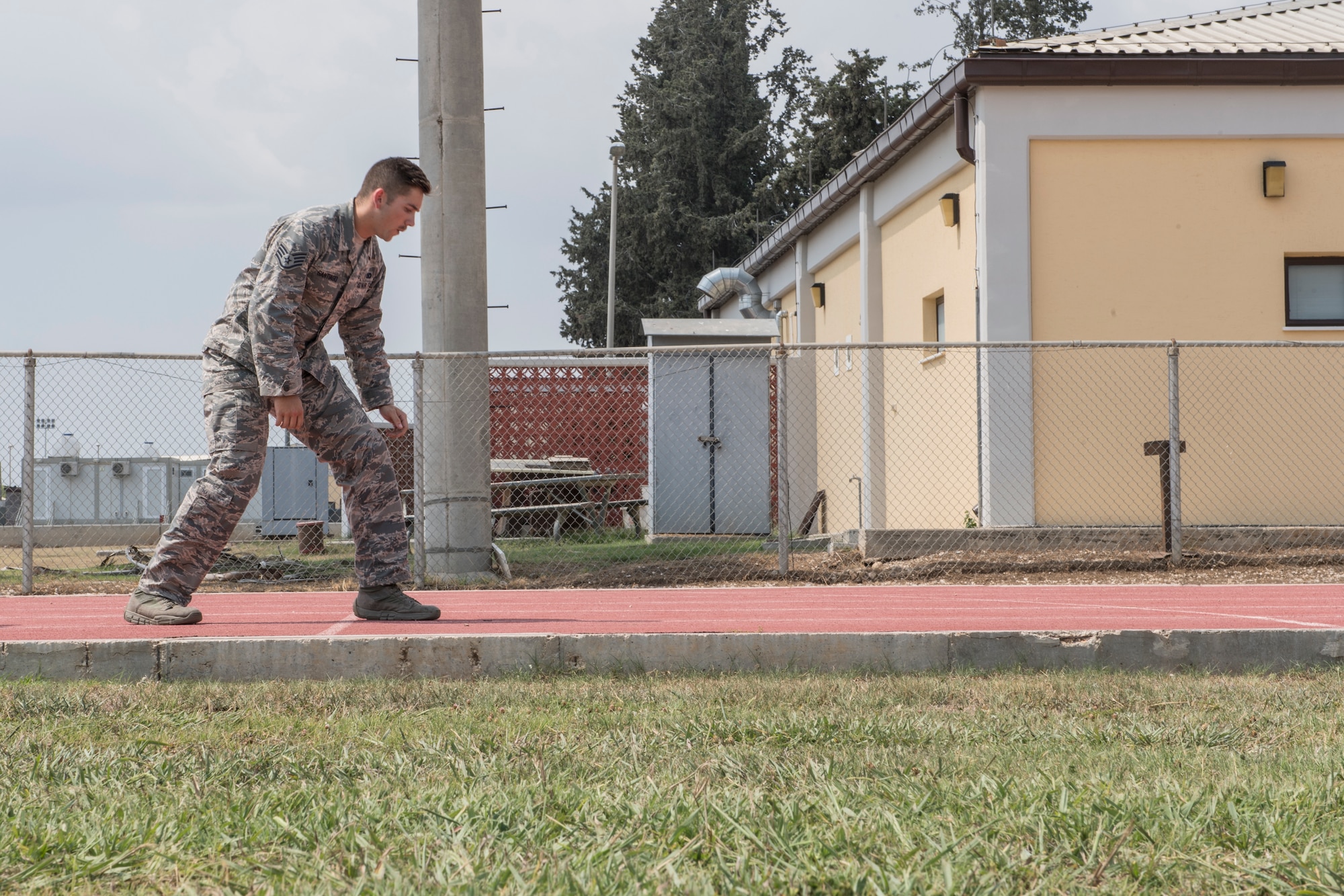 An Airman prepares to begin an obstacle course