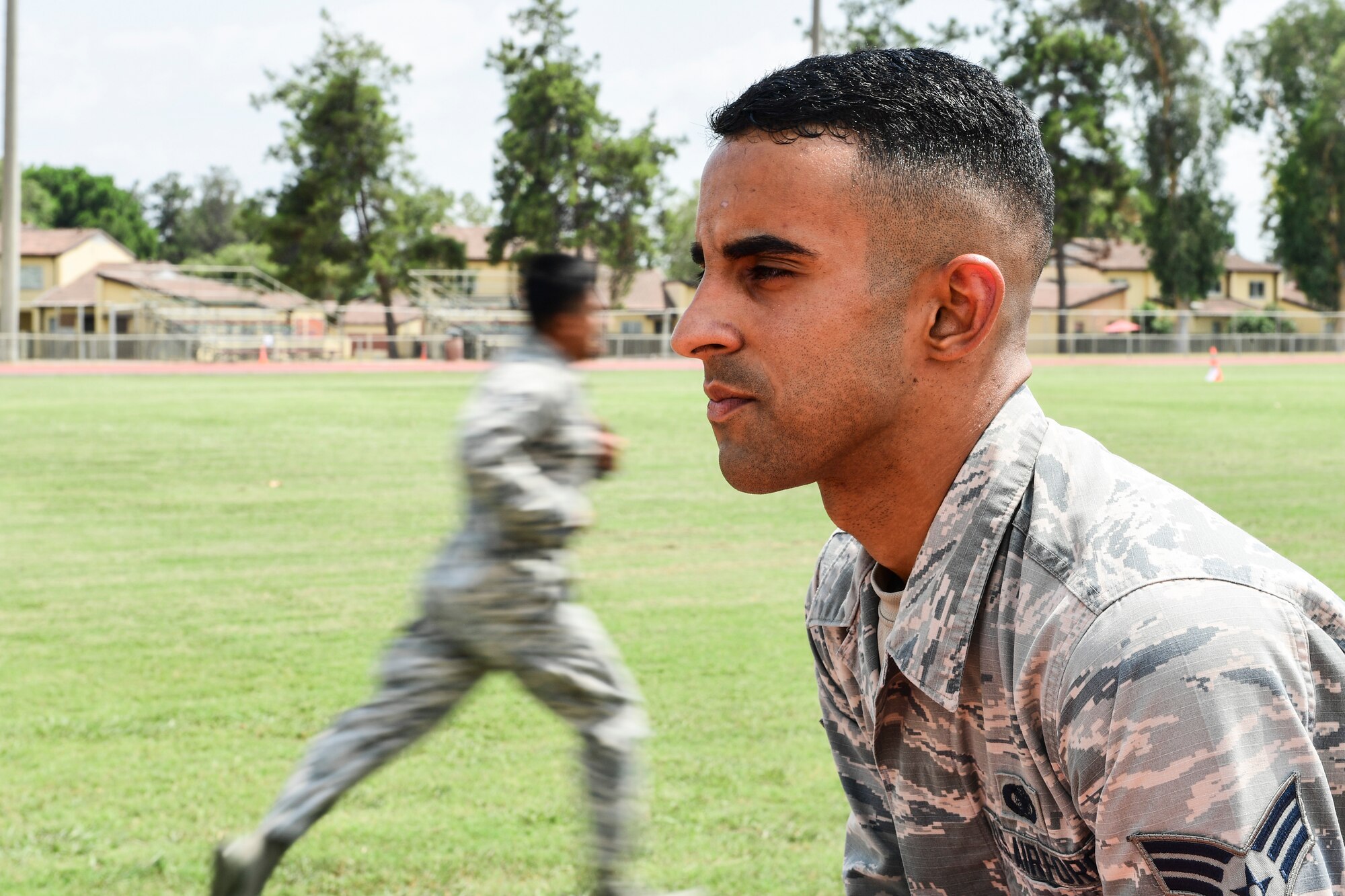 An Airmen prepares to run an obstacle course.