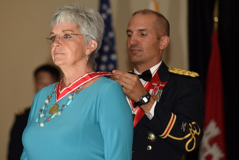 Col. Paul J. Kremer, U.S. Army Corps of Engineers Great Lakes and Ohio River Division deputy commander, presents the Bronze Order of the De Fleury Medal to Patty Coffey, Nashville District deputy district engineer, during the Nashville District 130th Anniversary Ball Aug. 18, 2018 at the Embassy Suites in Nashville, Tenn. (USACE Photo by Lee Roberts)