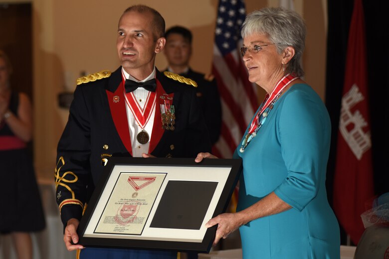 Col. Paul J. Kremer, U.S. Army Corps of Engineers Great Lakes and Ohio River Division deputy commander, presents the Bronze Order of the De Fleury Medal to Patty Coffey, Nashville District deputy district engineer, during the Nashville District 130th Anniversary Ball Aug. 18, 2018 at the Embassy Suites in Nashville, Tenn. (USACE Photo by Lee Roberts)