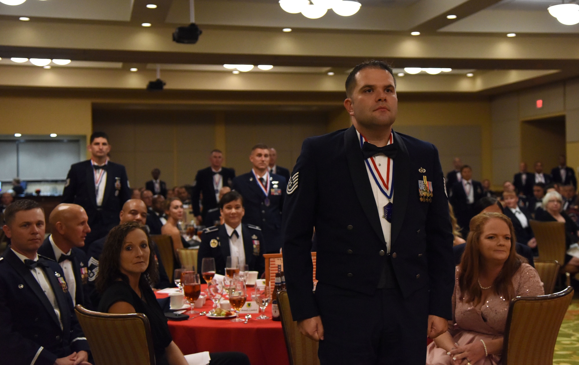 U.S. Air Force Tech. Sgt. Richard Ziff, 81st Training Wing safety office superintendent, stands among Senior NCO Inductees during the Senior NCO Induction Ceremony at the Bay Breeze Event Center at Keesler Air Force Base, Mississippi, Aug. 17, 2018. More than 50 inductees were recognized during the event. A medallion ceremony and a candle lighting ceremony also took place during the event. (U.S. Air Force photo by Kemberly Groue)