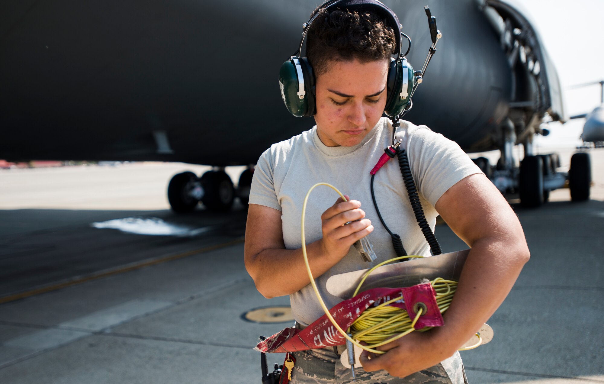 Airman 1st Class Tatiana Orr, 60th Aircraft Maintenance Squadron crew chief, wraps power chords prior to the launch of C-5M Super Galaxy on Aug. 12, 2018, at Travis Air Force Base, Calif. The 349th and 60th AMXS work together to launch aircraft in a seemless active duty and Air Force Reserve integration.