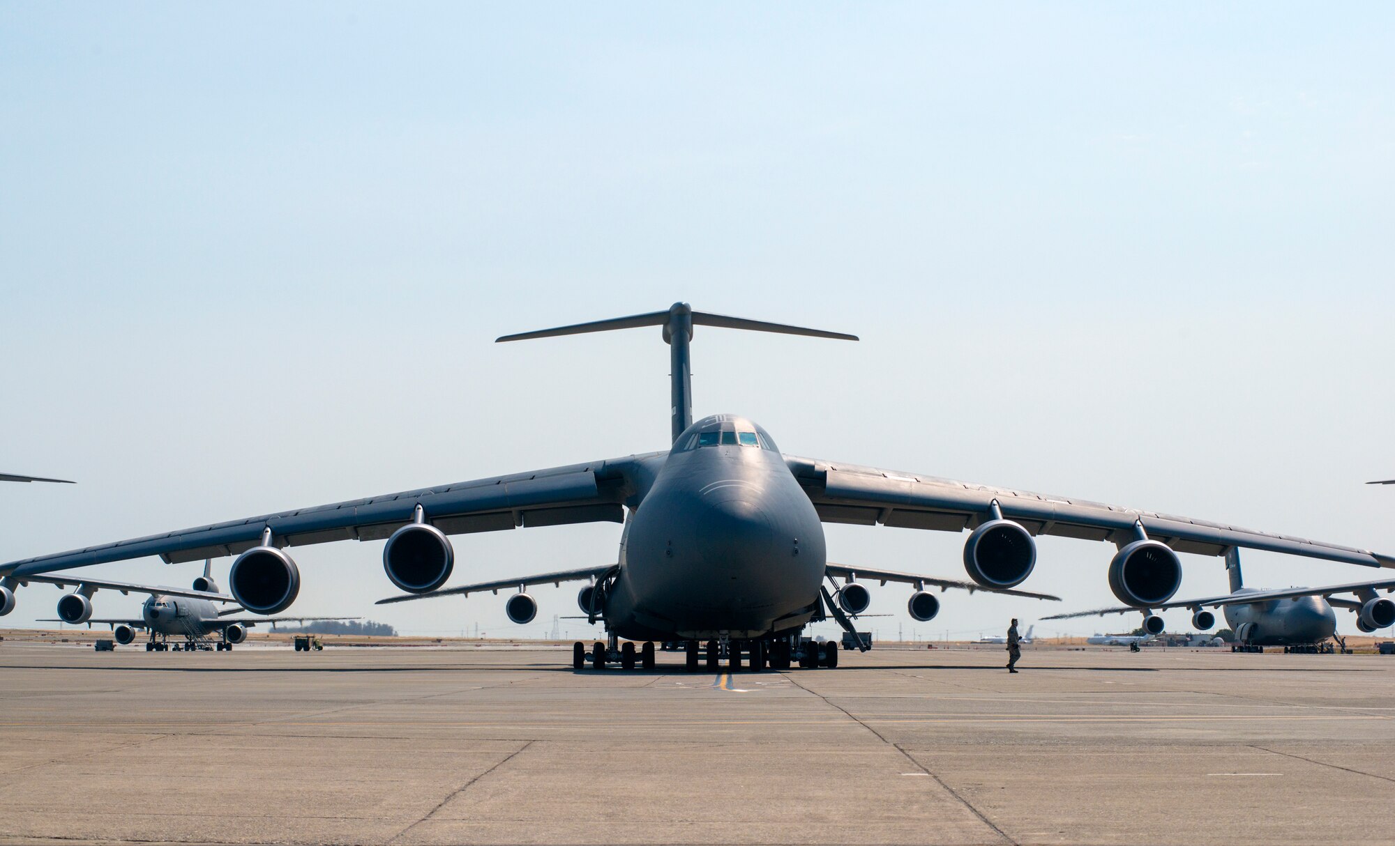 A crew chief from the 349th Aircraft Maintenance Squadron performs a final check on a C-5M Super Galaxy on Aug. 11, 2018, at Travis Air Force Base, Calif. The 349th and 60th AMXS work together to launch aircraft in a seemless active duty and Air Force Reserve integration.