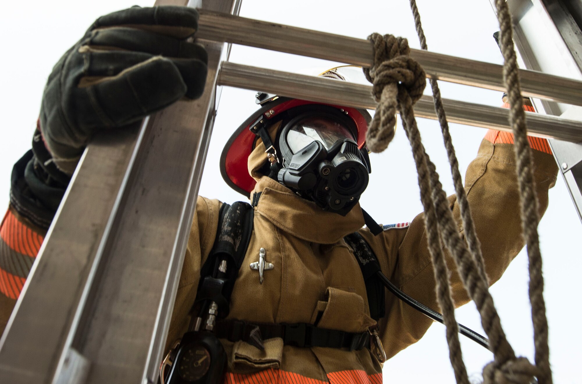 U.S. Air Force Staff Sgt. Zachary Dieleman, 20th Civil Engineer Squadron firefighter craftsman, climbs a ladder during proficiency training at Shaw Air Force Base, S.C., Aug. 18, 2018.