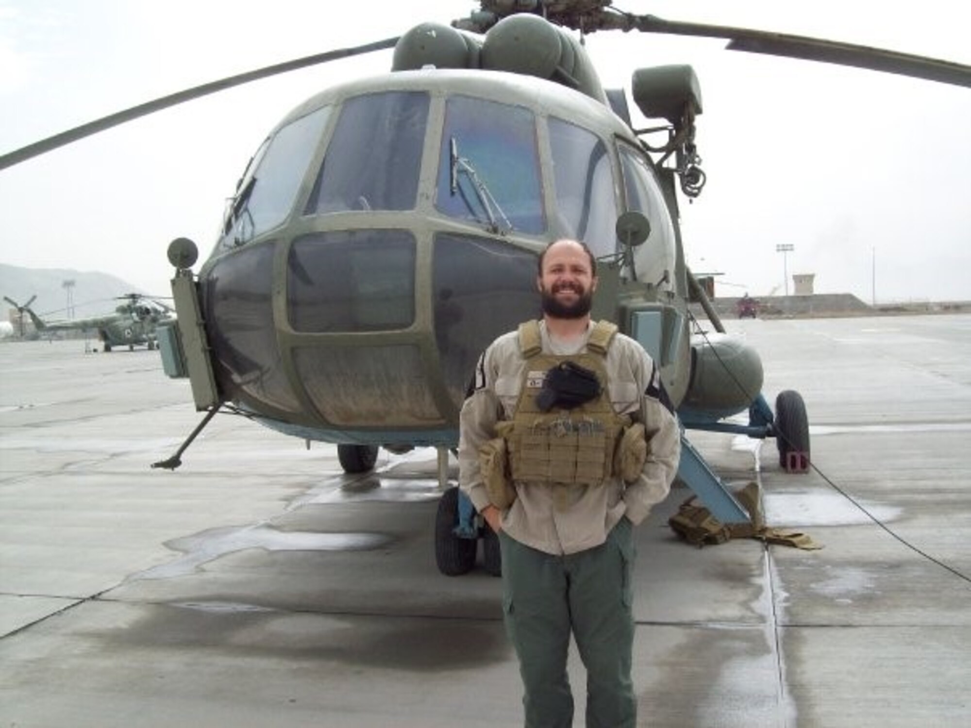 Matthew, Northrup-Grumman chief pilot, stands in front of his Russian Mil Mi-17 helicopter in Afghanistan in 2011. During this point in his career, Matthew also served in the U.S. Army Reserves while taking seminary classes online which would lead to his current assignment as a U.S. Air Force Chaplain at Creech Air Force Base, Nev. (Courtesy photo)