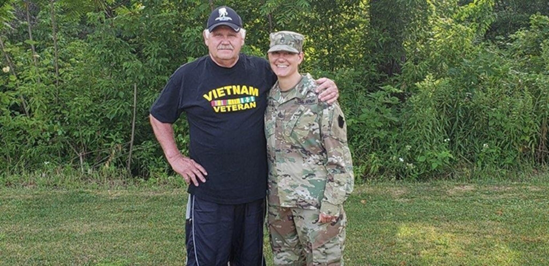 Vietnam veteran John Schilinski and his daughter, Staff Sgt. Rachel Kovach, a squad leader with 2nd Platoon, Company A, 1st Battalion, 112th infantry Regiment, 56th Stryker Brigade Combat Team, 28th Infantry Division, share an afternoon together comparing experiences with the military.