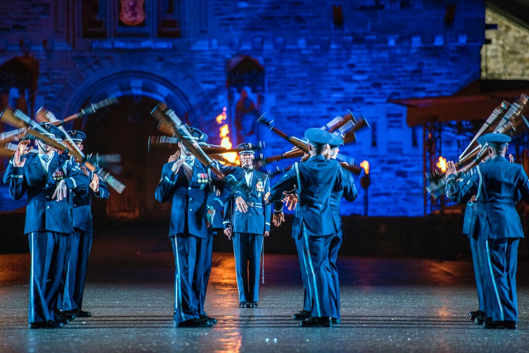 The Air Force Honor Guard Drill Team performs in front of Edinburgh Castle.
