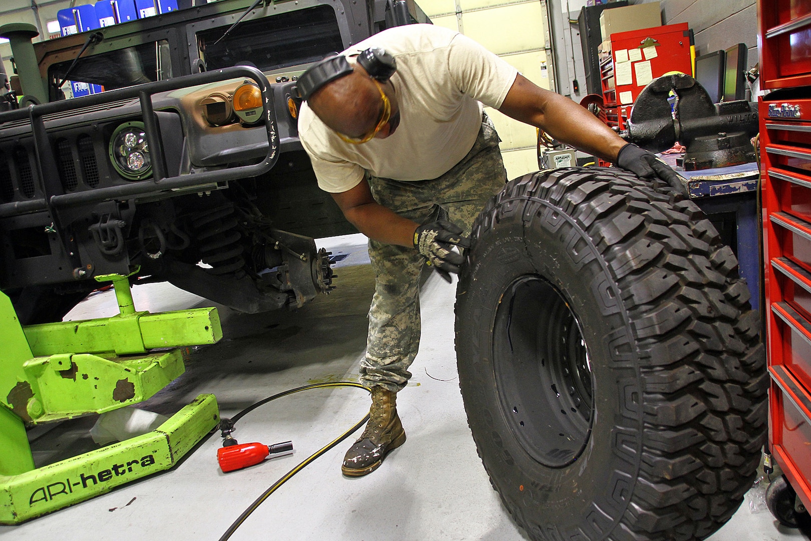Sgt. Rudon Gay inspects a tire prior to installation on a Humvee at Field maintenance Shop #5 in Frankfort, Ky., Aug 17, 2018. More than 1,200 tires were considered damaged and replaced on Kentucky Guard vehicles after a defect was discovered in the Spring of 2018.