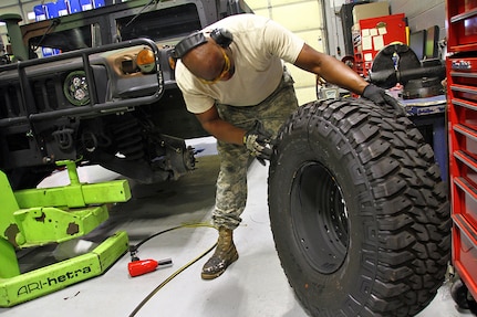 Sgt. Rudon Gay inspects a tire prior to installation on a Humvee at Field maintenance Shop #5 in Frankfort, Ky., Aug 17, 2018. More than 1,200 tires were considered damaged and replaced on Kentucky Guard vehicles after a defect was discovered in the Spring of 2018.