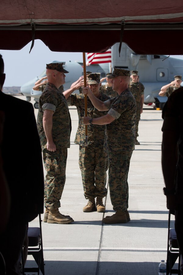 MARINE CORPS AIR STATION MIRAMAR, Calif. – Col. Craig Leflore, right, commanding officer of Marine Aircraft Group (MAG) 16, 3rd Marine Aircraft Wing, passes the organizational colors to Lt. Col. Mathew T. McSorley, commanding officer of VMM-362, MAG-16, during the activation ceremony at Marine Corps Air Station Miramar, Calif., Aug. 17. The passing of the organizational colors signifies a formal transfer of authority and responsibility from one commanding officer to another. (U.S. Marine Corps photo by Lance Cpl. Juan Anaya)