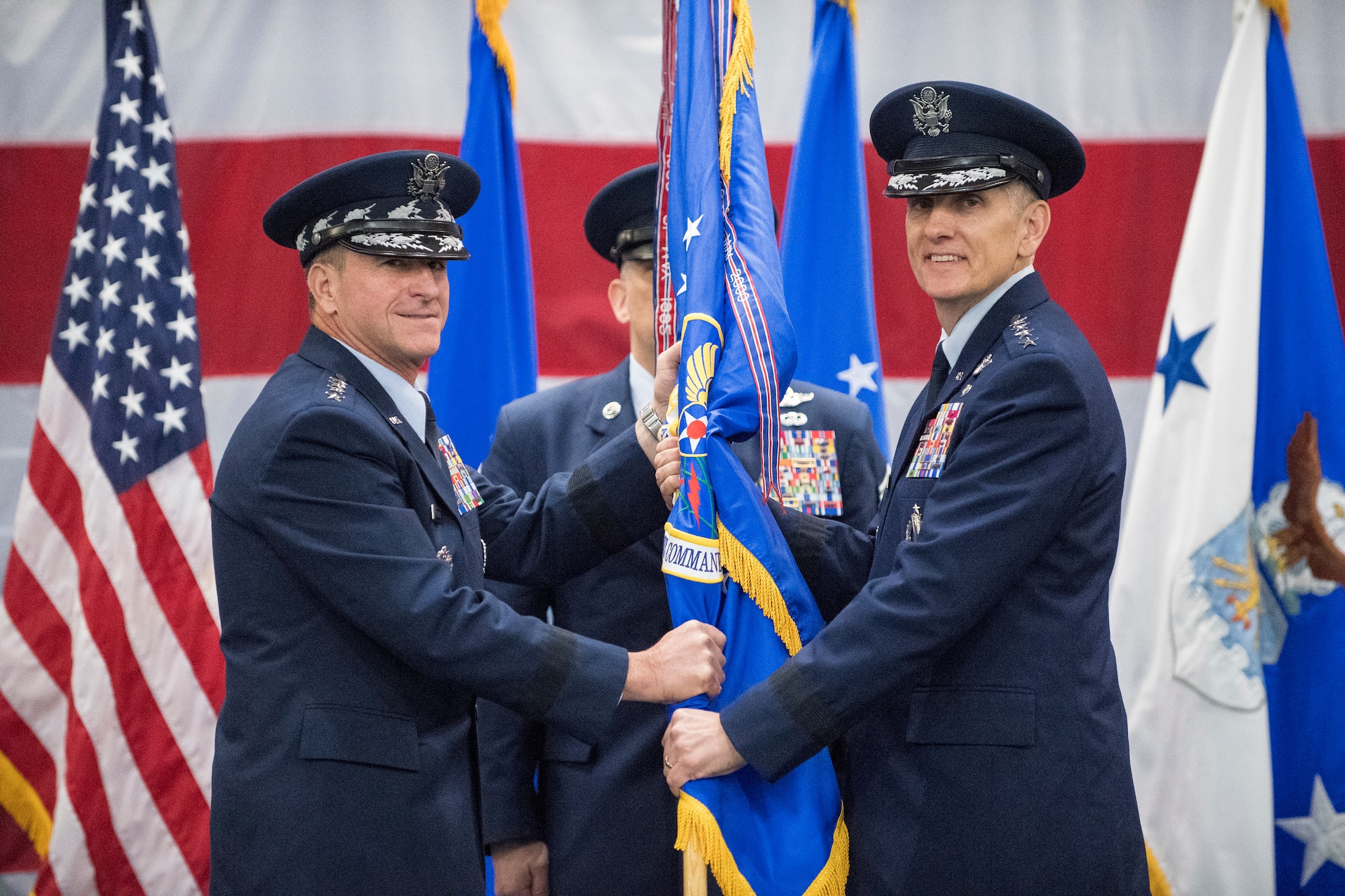 Gen. Timothy Ray accepts the Air Force Global Strike Command guidon from the Air Force Chief of Staff Gen. David L. Goldfein during a change of command ceremony at Barksdale Air Force Base, La., Aug. 21, 2018.