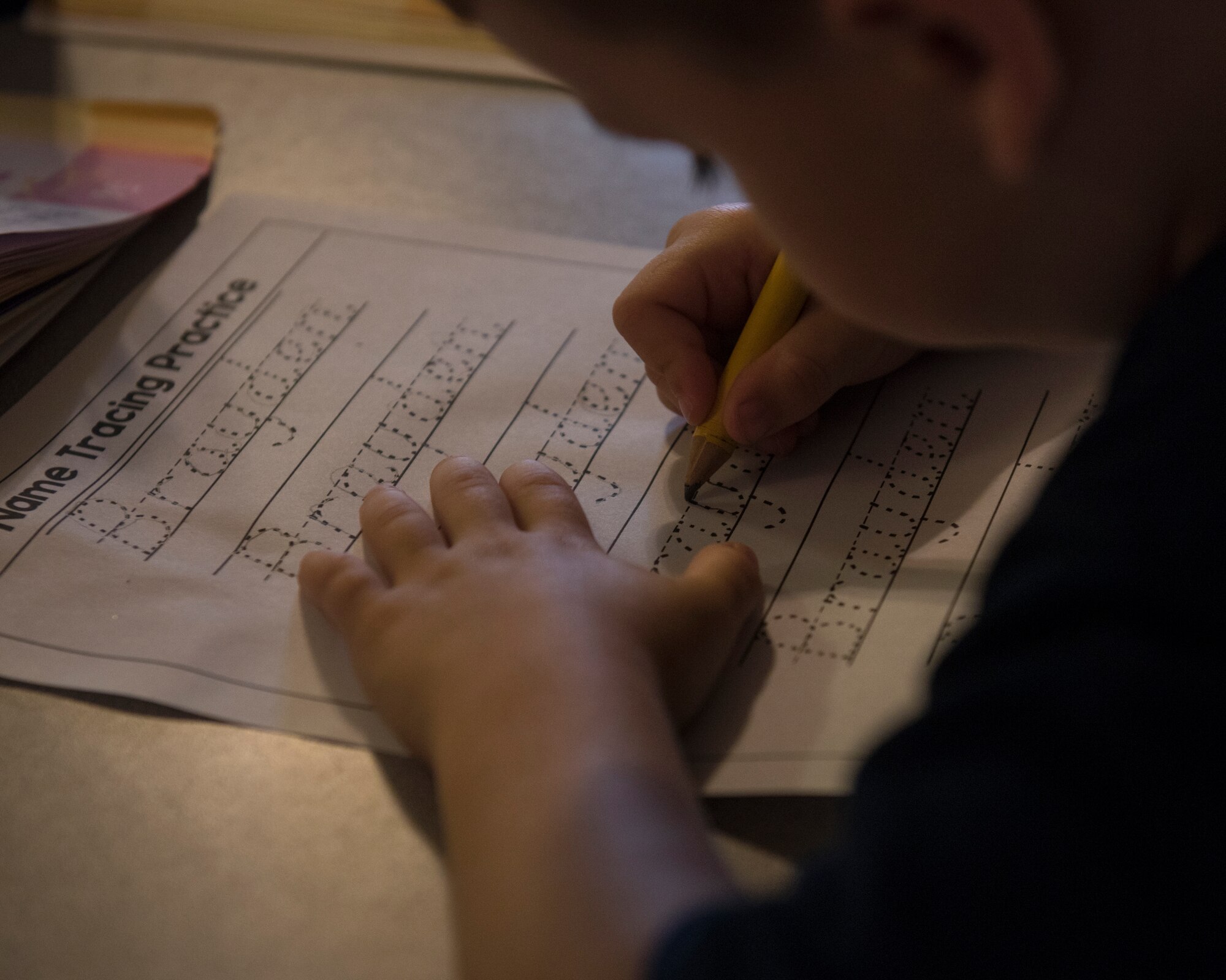 Team Fairchild child practices arithmetic at a Family Child Care program provider’s house at Fairchild Air Force Base, Washington, Aug. 16, 2018. The FCC offers families an option of a consistent and personal learning space for child care in an in-home environment. (U.S. Air Force photo/Airman 1st Class Whitney Laine)