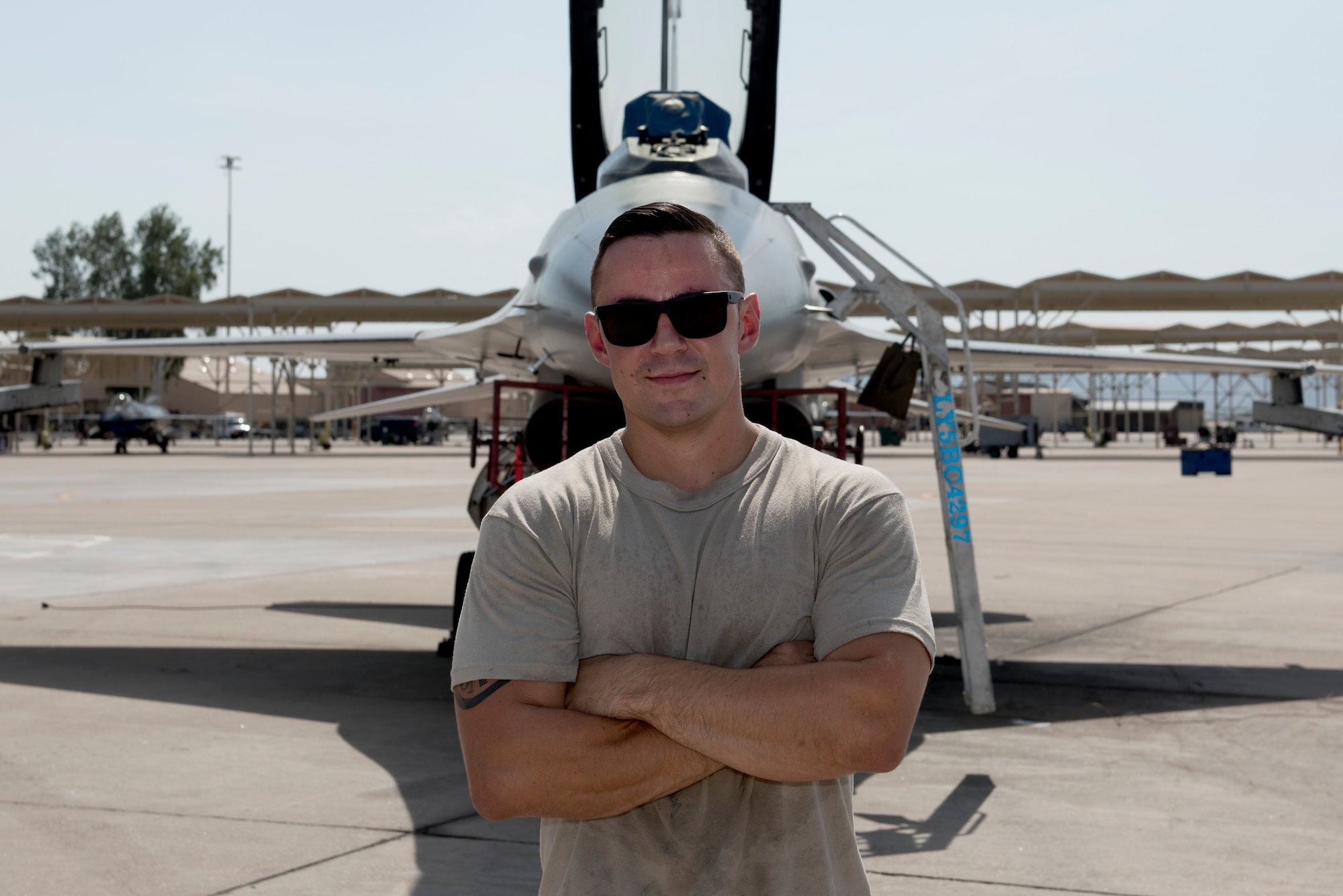 Staff Sgt. Tanner Apple, 309th Aircraft Maintenance Unit dedicated crew chief, poses for a photograph Aug. 20, 2018, at Luke Air Force Base, Ariz. Apple was awarded the 2017 Thomas N. Barnes award for the best dedicated crew chief in the Air Force. (U.S. Air Force photo by Senior Airman Ridge Shan)