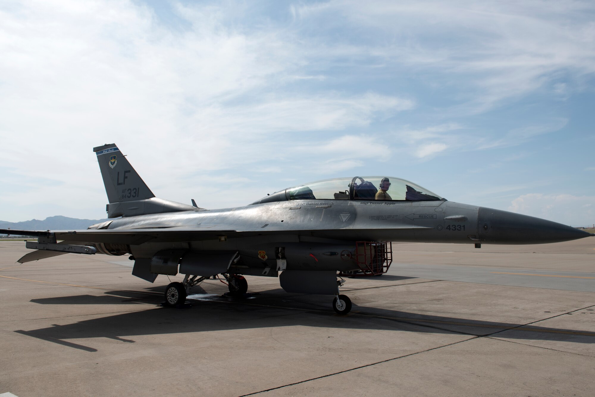 Staff Sgt. Tanner Apple, 309th Aircraft Maintenance Unit dedicated crew chief, runs an engine test on his F-16 Fighting Falcon, Aug. 20, 2018, at Luke Air Force Base, Ariz. Tanner was awarded the 2017 Thomas N. Barnes award for the best dedicated crew chief in the Air Force. (U.S. Air Force photo by Senior Airman Ridge Shan)