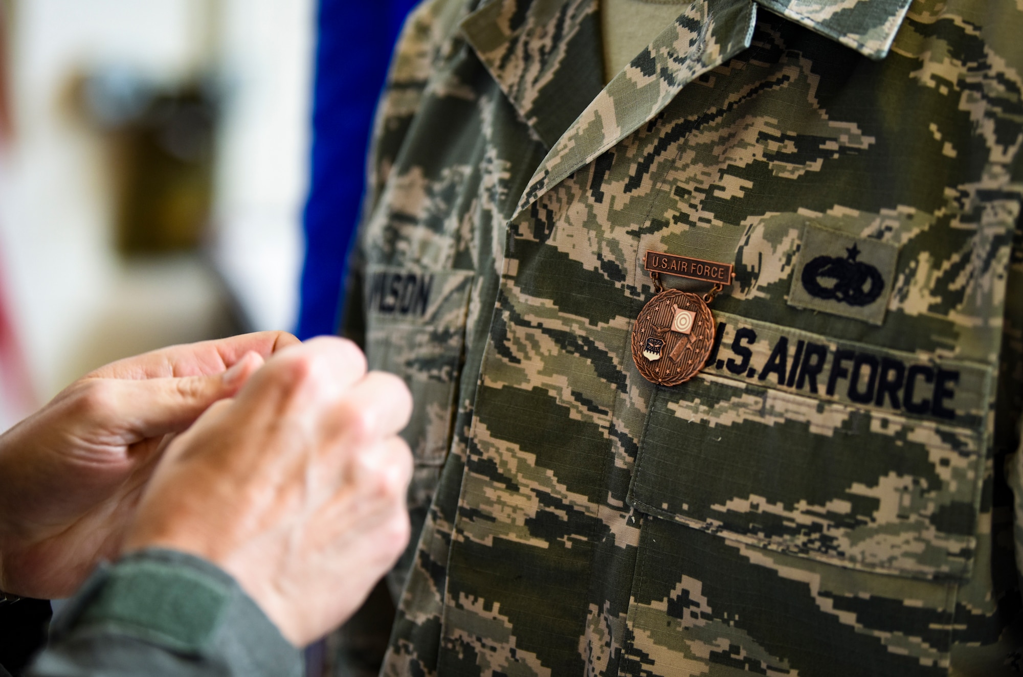 Brig. Gen. Robert G. Novotny, 57th Wing commander, pins the President’s Hundred medal onto Staff Sgt. Andrew Wilson, 757th Aircraft Maintenance Squadron Strike Aircraft Maintenance Unit F-15E Strike Eagle fighter jet crew chief, at Nellis Air Force Base, Nevada, Aug. 15, 2018. There is only four other Airmen on active-duty that wear the tab. (U.S. Air Force photo by Airman 1st Class Andrew D. Sarver)