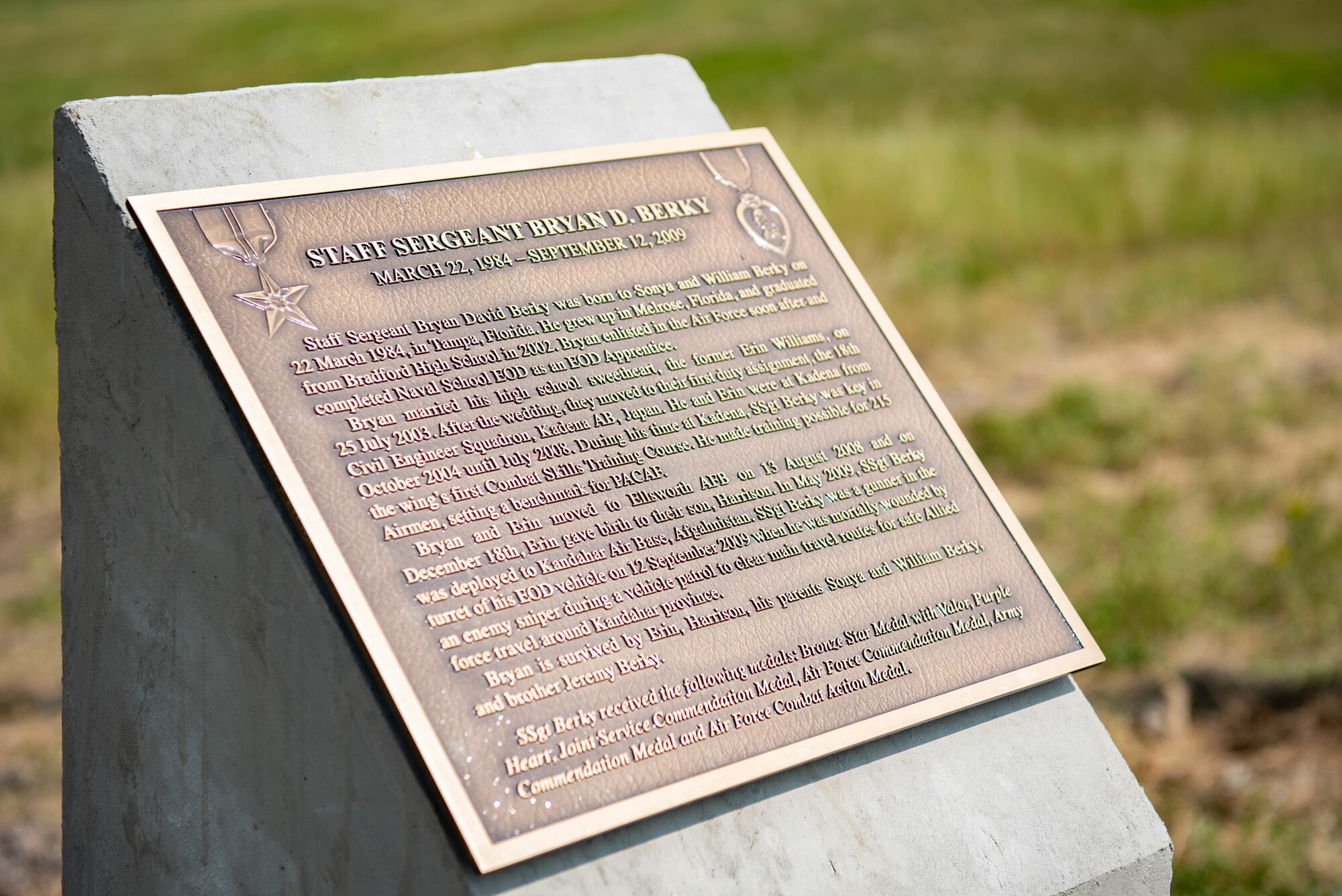 A memorial is revealed for Staff Sgt. Bryan D. Berkey, a former 28th Civil Engineer Squadron explosive ordnance disposal technician, during an EOD range dedication ceremony at Ellsworth Air Force Base, S.D., Aug. 17, 2018.  Berkey was killed in action during a deployment while serving in the western province of Farah, Afghanistan, on Sept. 12, 2018. The EOD range at Ellsworth AFB was named in his honor. (U.S. Air Force photo by Tech. Sgt. Jette Carr)