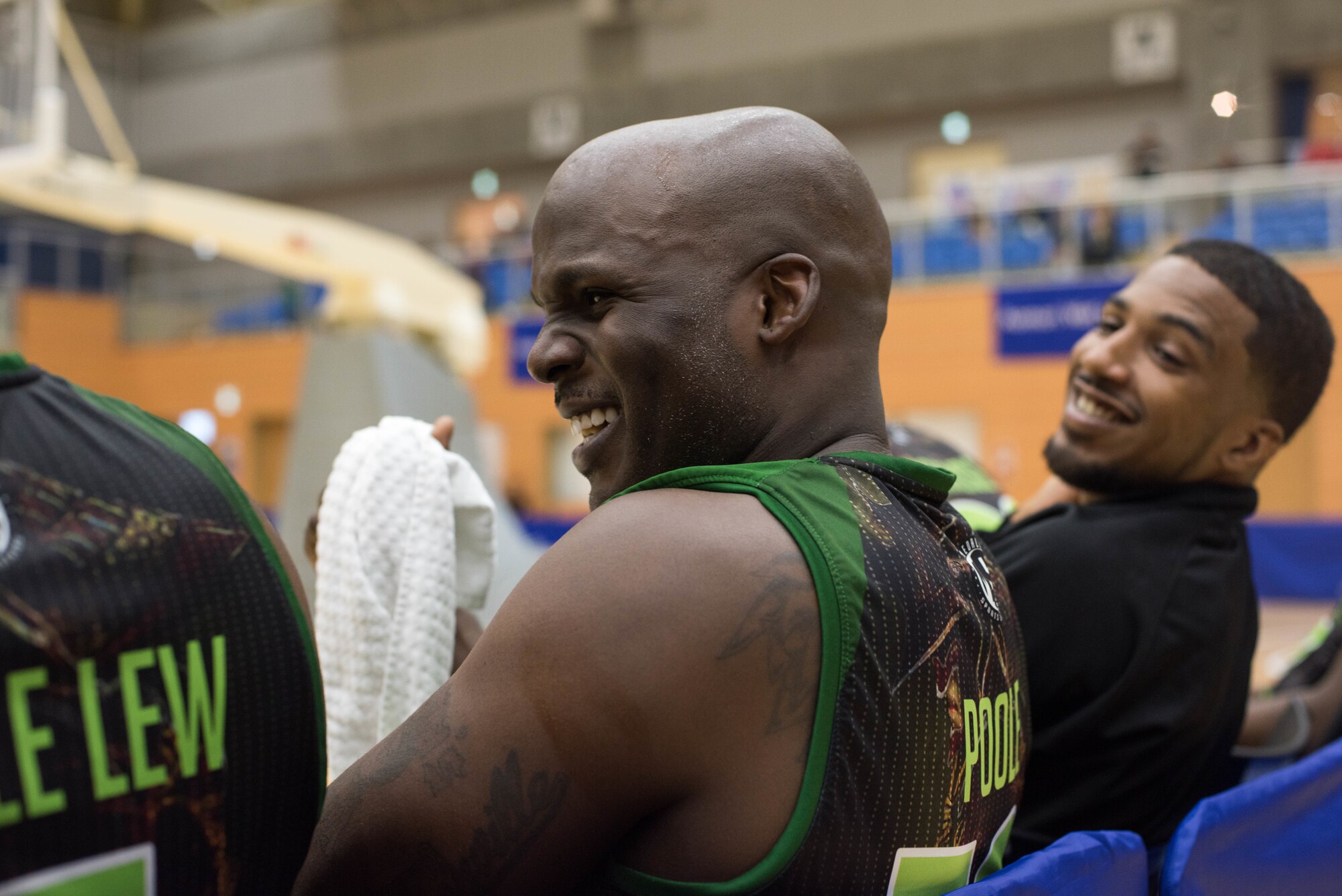 U.S. Air Force Tech. Sgt. Demarco Poole, a Misawa Jets member and 35th Civil Engineer Squadron electrical systems craftsman, laughs with his teammates as the game ends during their exhibition match with the Aomori Wat’s at the Misawa International Sports Center in Misawa City, Japan, Aug. 18, 2018. The Wat’s proved more difficult a competitor but the Jets kept up the pace into halftime with the Wat’s leading 46-35. By the game’s final buzzer, the Wat’s increased their lead closing the game, 104-75. (U.S. Air Force photo by Tech. Sgt. Benjamin W. Stratton)
