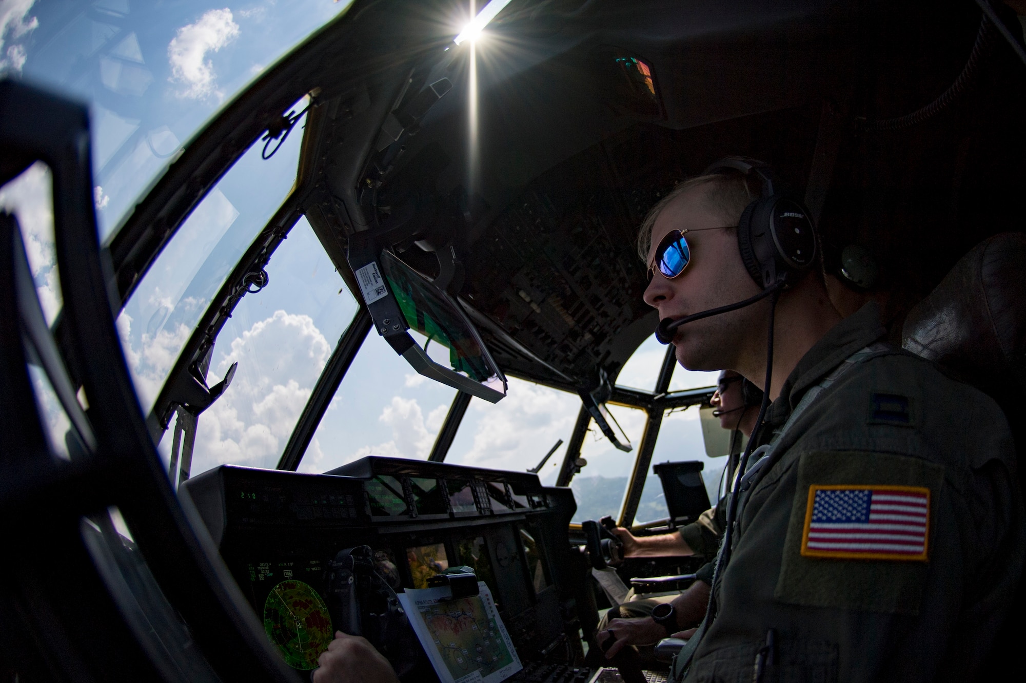 U.S. Air Force Capt. Bryant Bailey, 37th Airlift Squadron pilot, flies a C-130J Super Hercules aircraft over Romania with Lt. Col. Alex Miller, 37th AS director of operations, Aug. 21, 2018. Bailey and Miller flew low-level routes as part of exercise Carpathian Summer 2018. (U.S. Air Force photo by Senior Airman Devin Boyer)