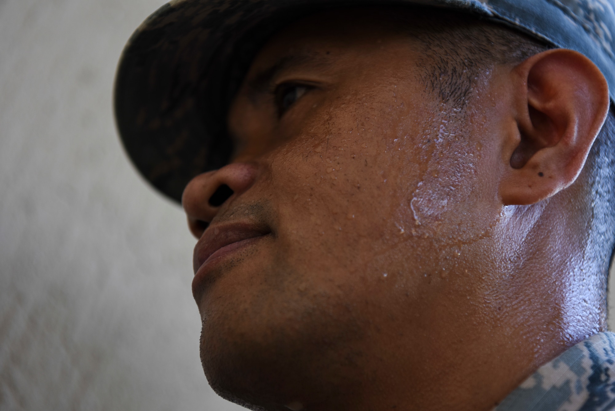 U.S. Air Force Tech. Sgt. Darlwin Langit, 8th Civil Engineer Squadron structural noncommissioned officer in charge, concentrates on placing plywood over a window at Kunsan Air Base, Republic of Korea, Aug. 22, 2018.  As Typhoon Soulik approaches the Korean peninsula, Airmen assigned to the 8th Fighter Wing prepare the air base to weather the storm. (U.S. Air Force photo by Senior Airman Savannah L. Waters)