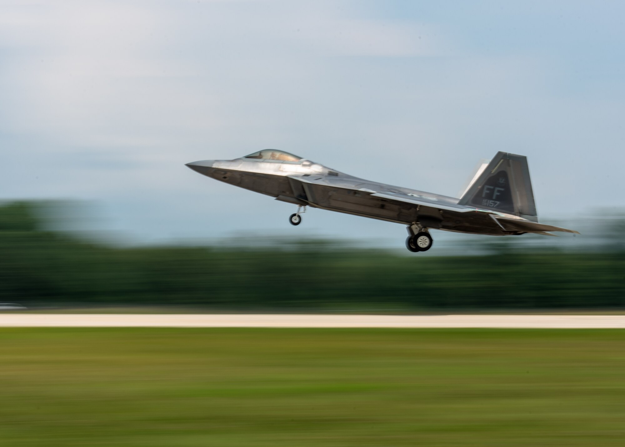 An F-22 Raptor lands at Volk Field Air National Guard Base, Wisconsin, during the Northern Lightning 18-2 Exercise Aug. 17, 2018. Northern Lightning is one of seven Air National Guard joint accredited exercises held at Volk Field(U.S. Air National Guard photo by Airman 1st Class Cameron Lewis)