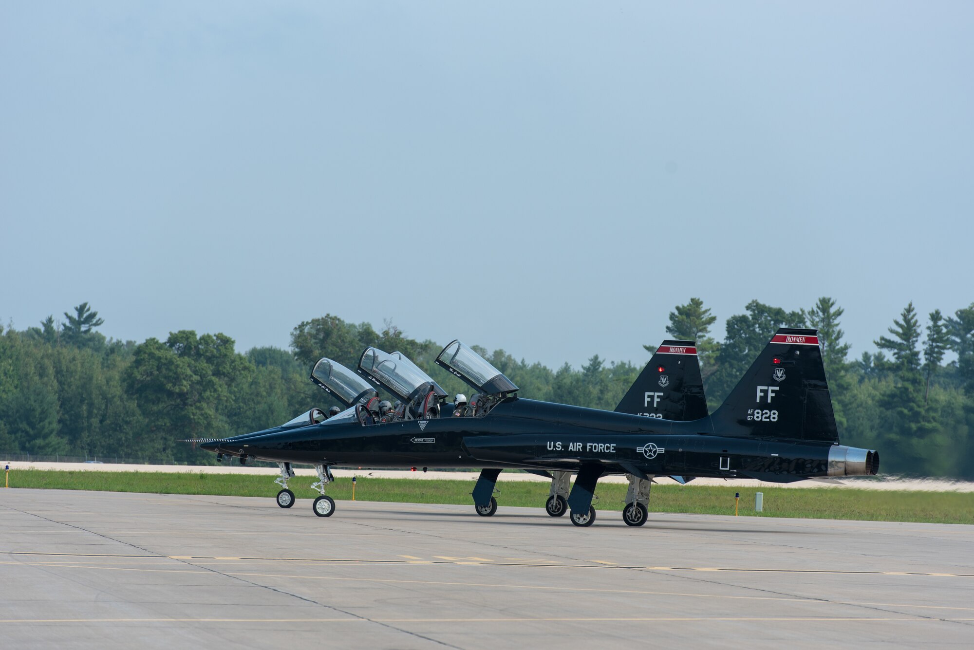 Two T-38 Talons hold on the flightline before taking off at Volk Field Air National Guard Base, Wisconsin, Aug. 17, 2018. The Talons are a part of the Northern Lightning 18-2 Exercise that takes place at Volk. (U.S. Air National Guard photo by Airman 1st Class Cameron Lewis)