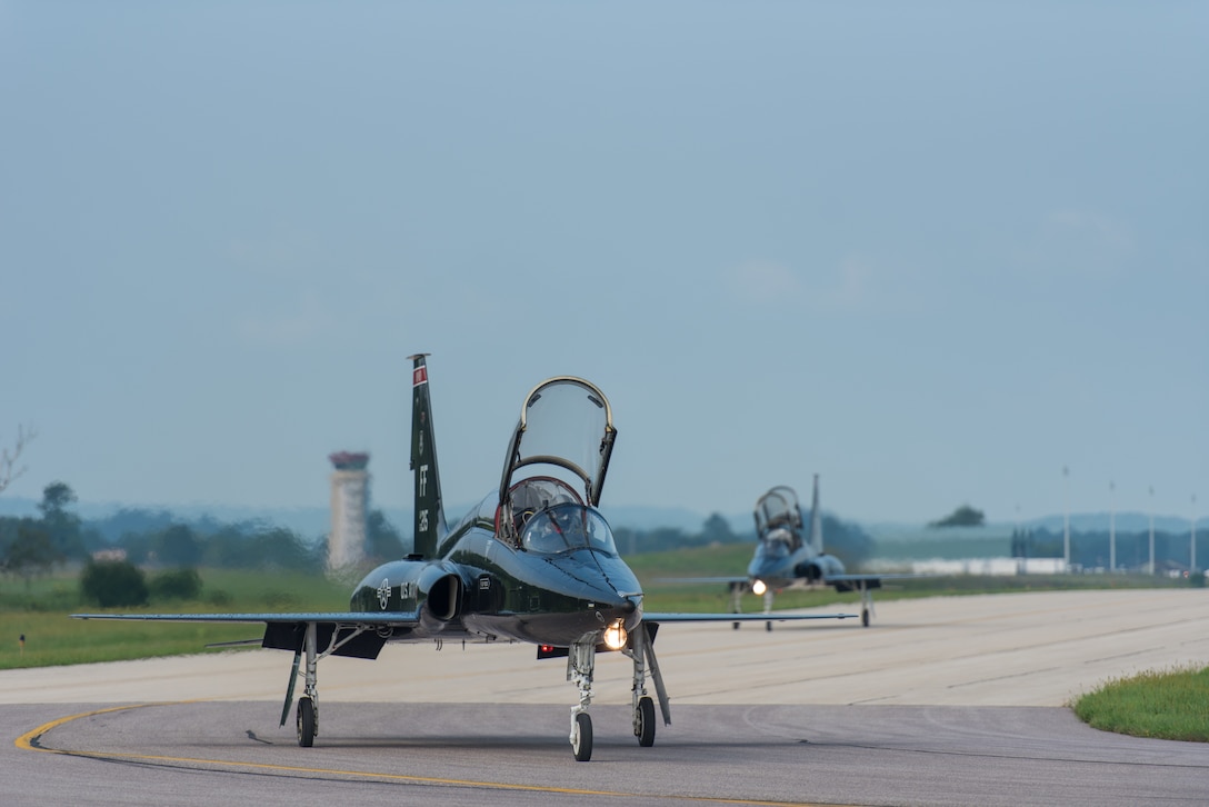 Two T-38 Talons taxi to the runway before taking off at Volk Field Air National Guard Base, Wisconsin, Aug. 17, 2018. The Talons are a part of the Northern Lightning 18-2 Exercise that takes place at Volk. (U.S. Air National Guard photo by Airman 1st Class Cameron Lewis)