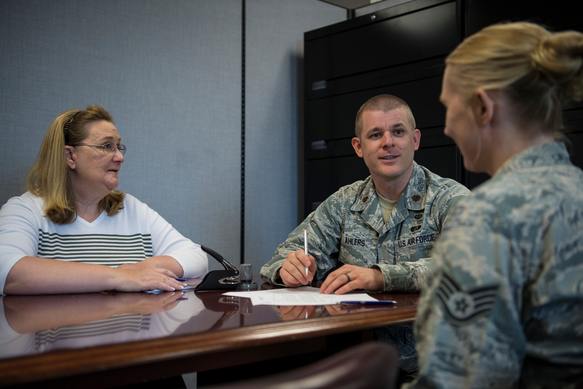 Maj. Joe Ahlers, 434th Air Refueling Wing staff judge advocate, advises an Airman on the importance of creating and maintaining a will at Grissom Air Reserve Base, Ind., Aug. 20, 2018. Ahlers was the 434th's Airman of the Year in 2008, and returned as an officer after being away for seven years. (U.S. Air Force photo / Senior Airman Harrison Withrow)