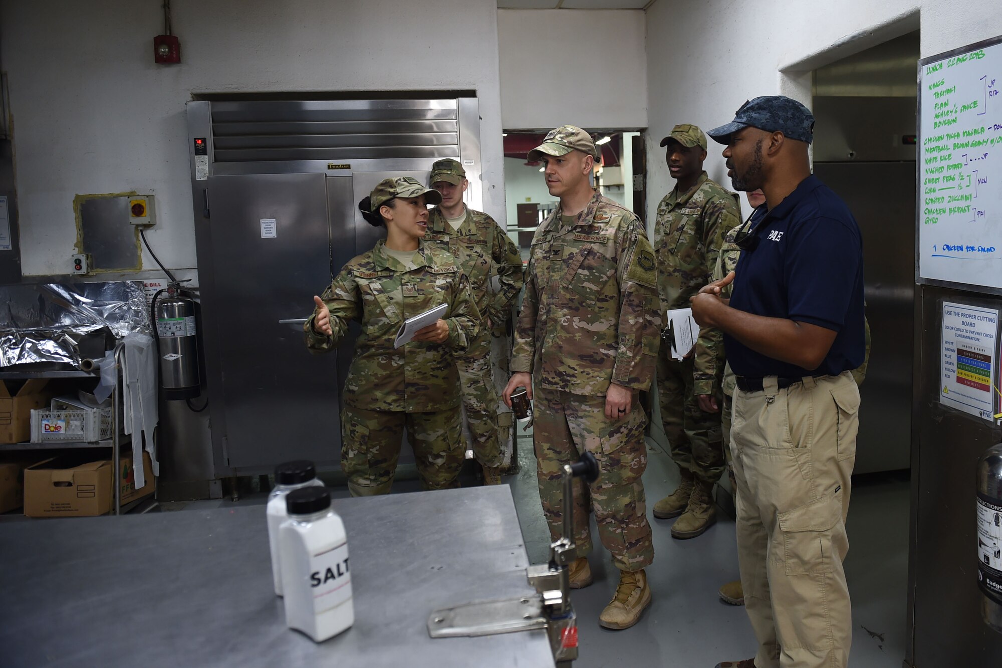 Airmen tour a kitchen