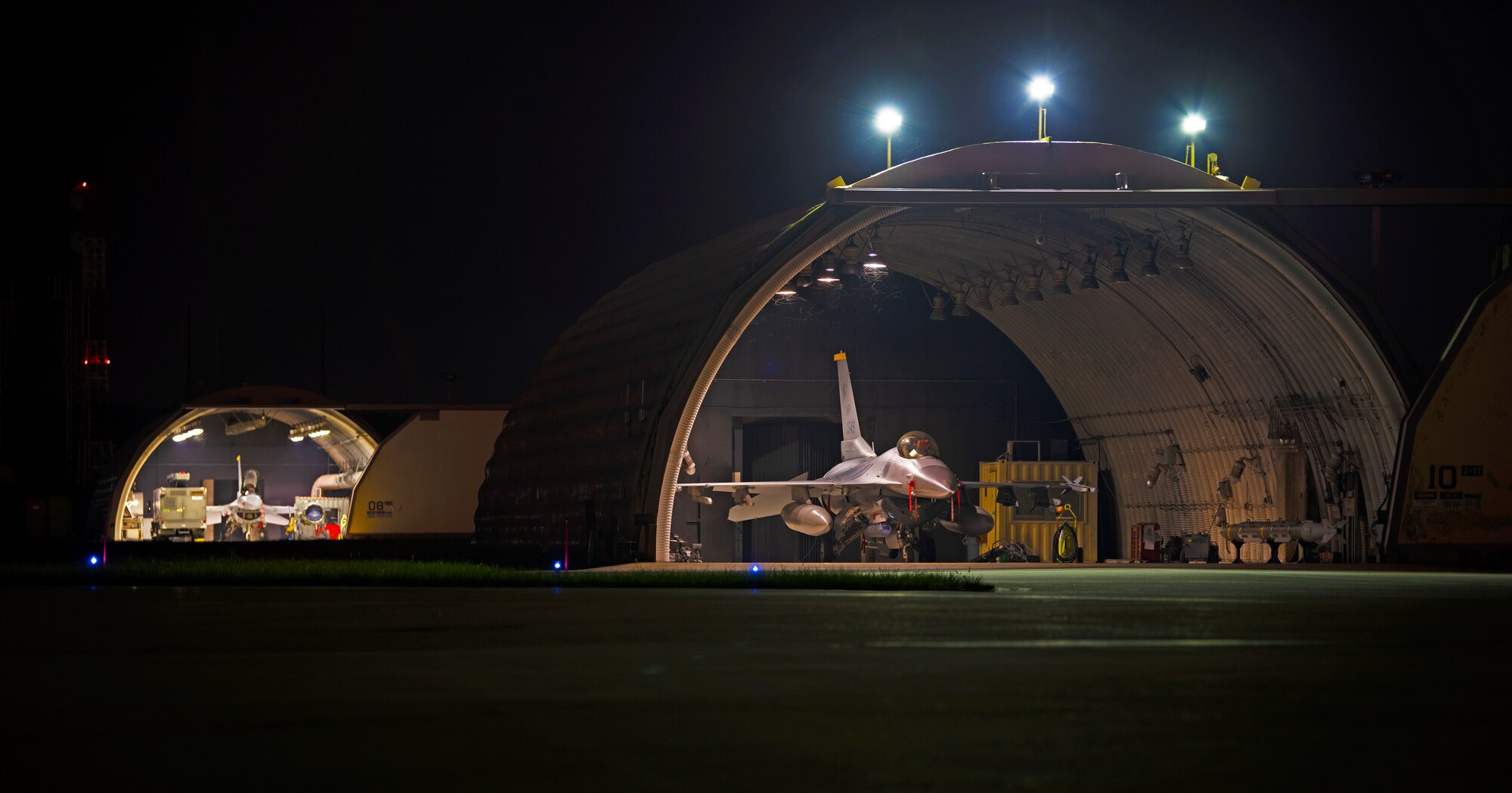 Two 8th Fighter Wing F-16 Fighting Falcons from the 80th Fighter Squadron “Juvats” is prepared for storage in anticipation of a typhoon on Aug. 22, 2018 at Kunsan Air Base, Republic of Korea. As part of preparation for Typhoon Soulik, 8th Fighter Wing personnel are taking measures, such as closing hardened aircraft shelters, to ensure all of their assets and personnel are secured and prepared for the adverse weather. (U.S. Air Force photo by Senior Airman Stefan Alvarez)